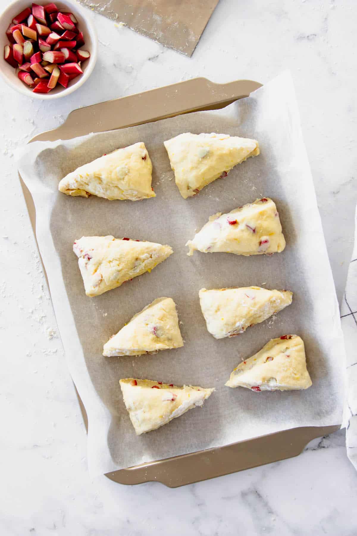 Rhubarb scones on a baking sheet ready to go in the oven