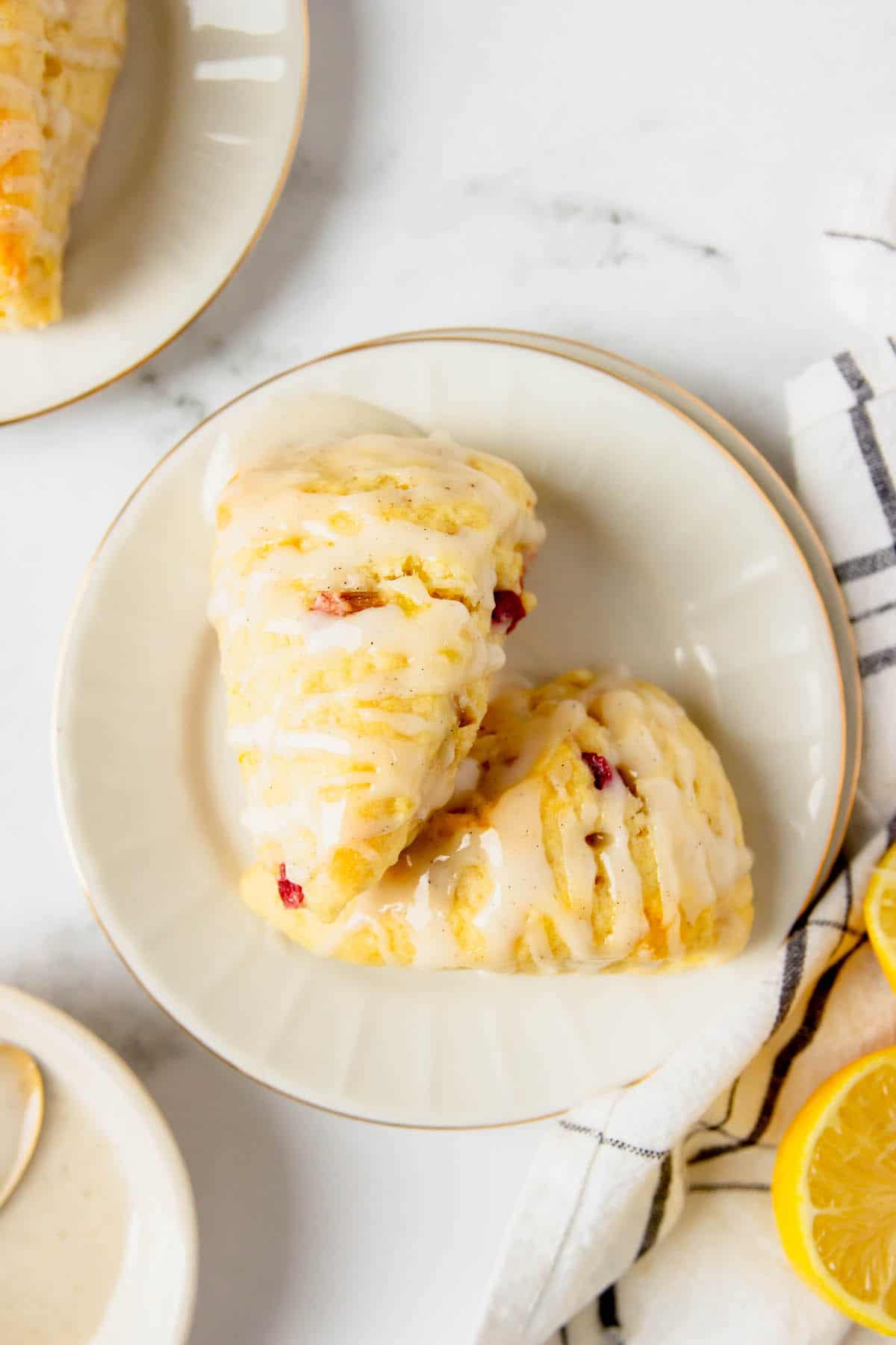 Two lemon rhubarb scones on a plate