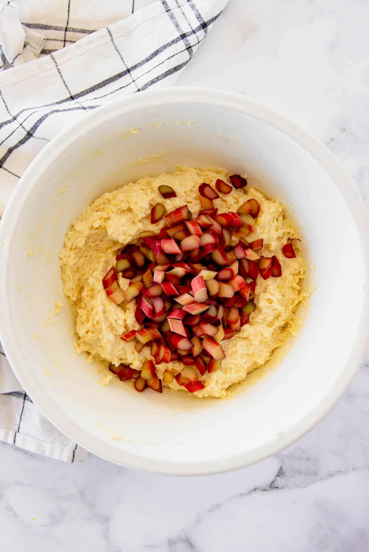 Lemon scone batter with chopped rhubarb pieces