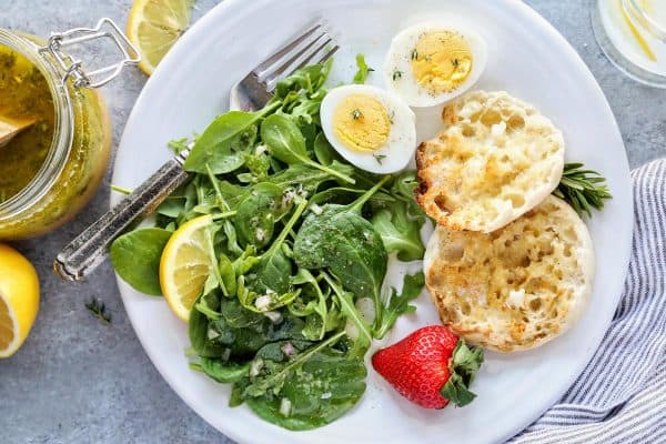 a breakfast meal with a small side salad