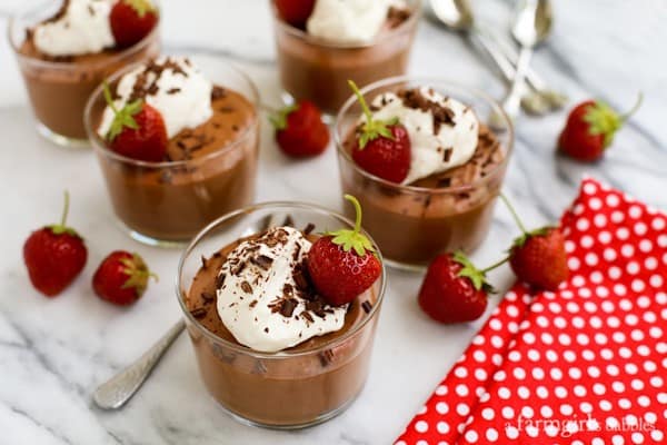 Chocolate Mousse Cups with whipped cream and chocolate shavings