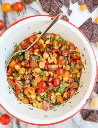 Top-view of a bowl of cherry tomato and ground cherry salsa in a bowl