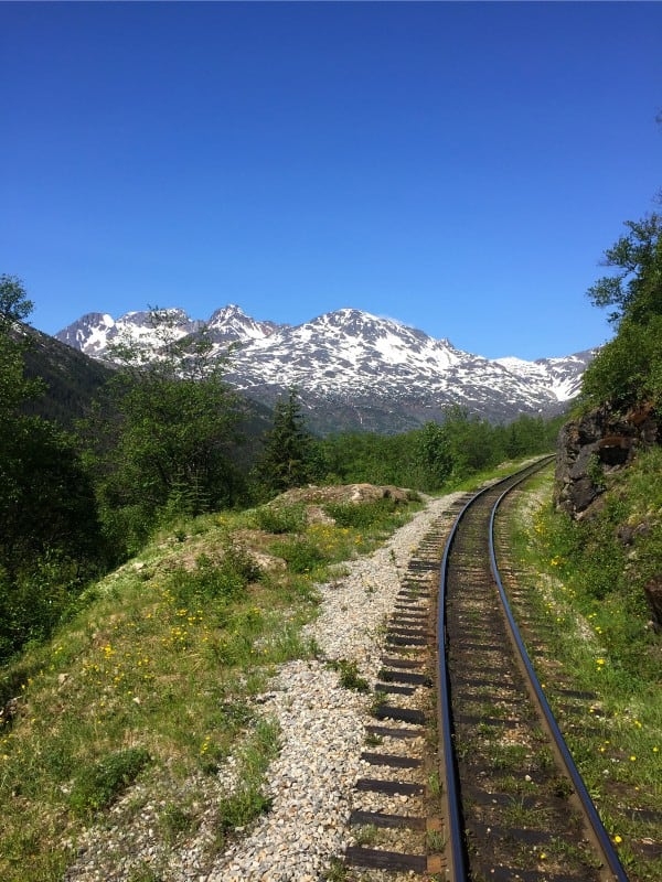 train tracks through a mountain