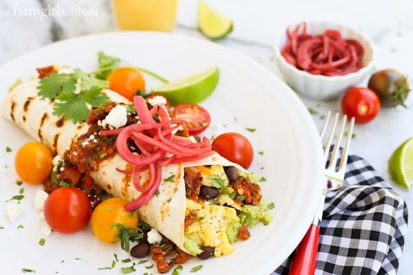 Huevos Rancheros Wrap with a black and white checked napkin