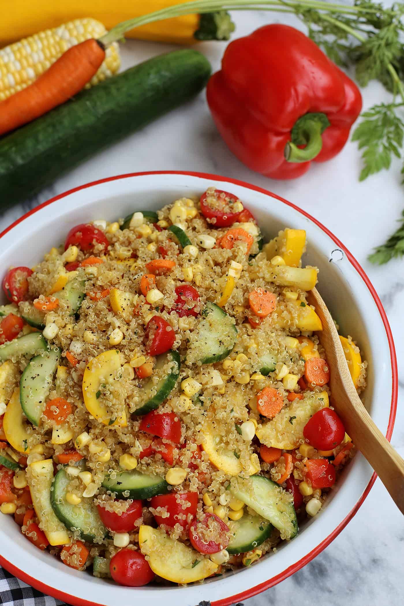 A bowl of end of summer quinoa salad with curry vinaigrette