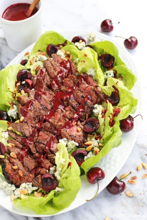 Steak Salad with Cherry-Chipotle Balsamic Vinaigrette, blue cheese, and pine nuts