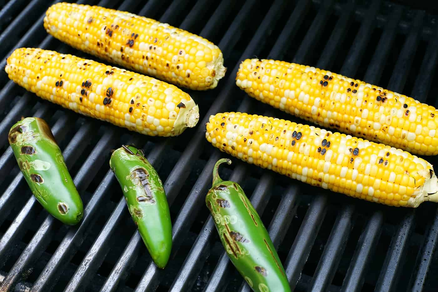 Corn cobs and jalapeno on a grill