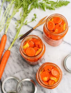 Overhead view of 3 jars of quick pickled carrots