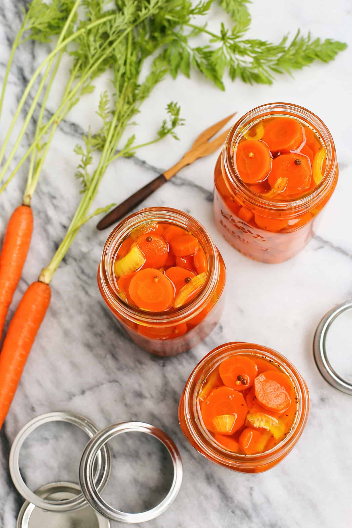 Overhead view of 3 jars of quick pickled carrots