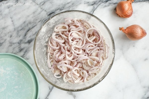 sliced shallots coated with flour