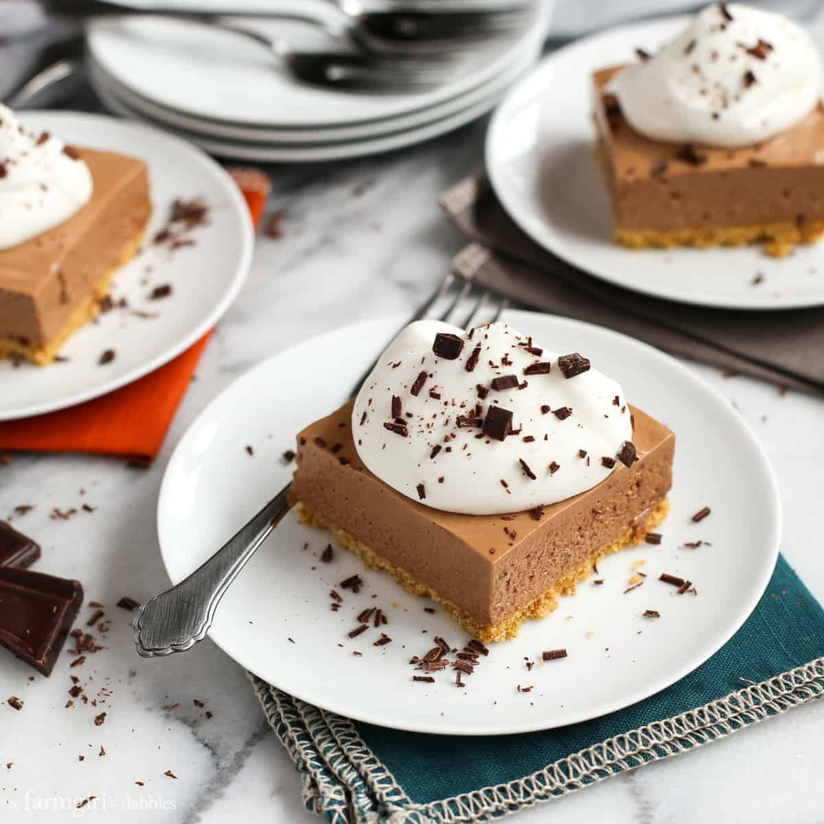 Chocolate French Silk Pie Bars with Graham Toffee Crust on white plates