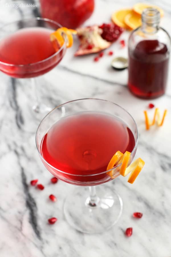 Cosmos in cocktail glasses with orange peel