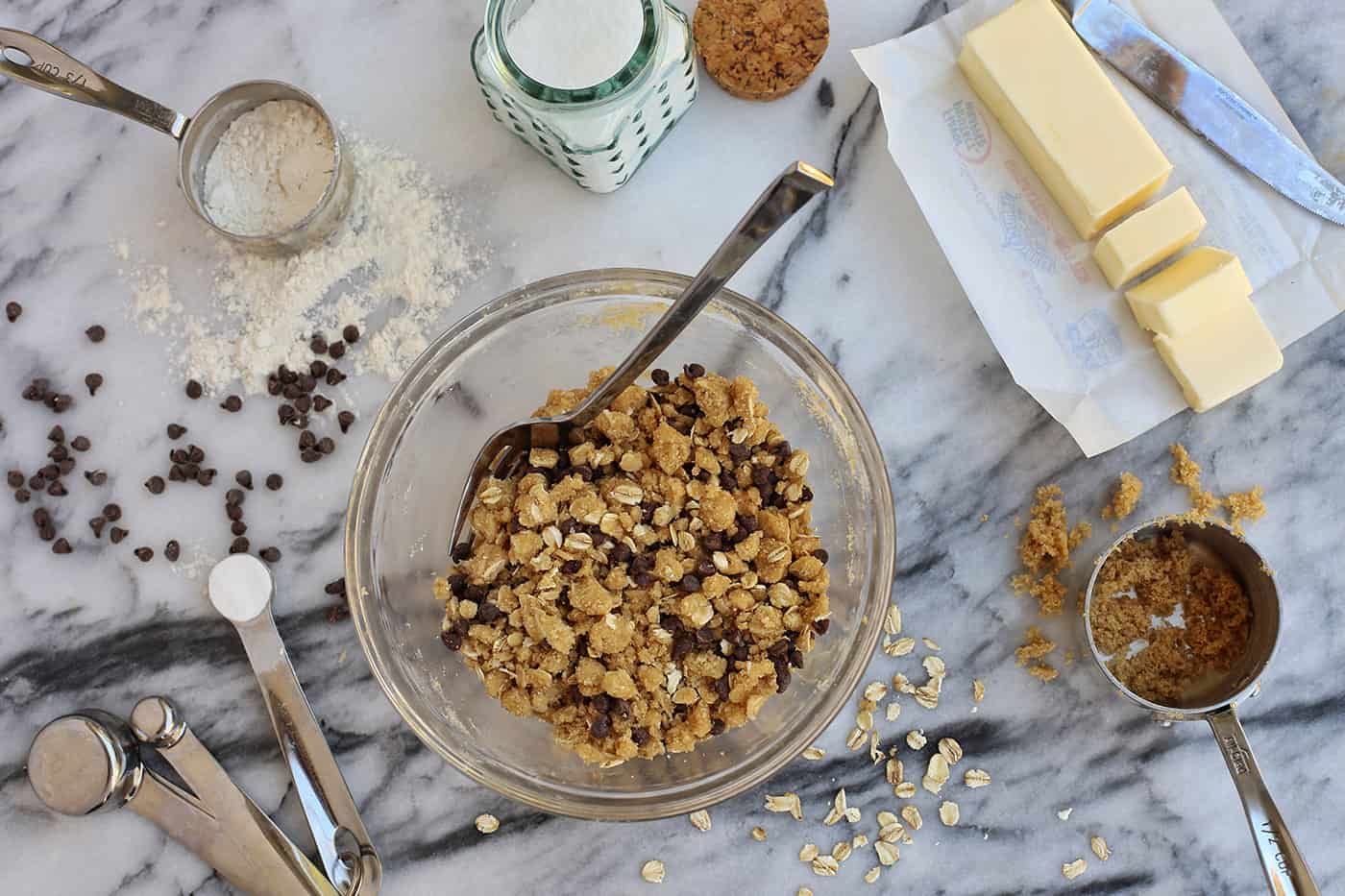 Oat and chocolate streusel in a mixing bowl