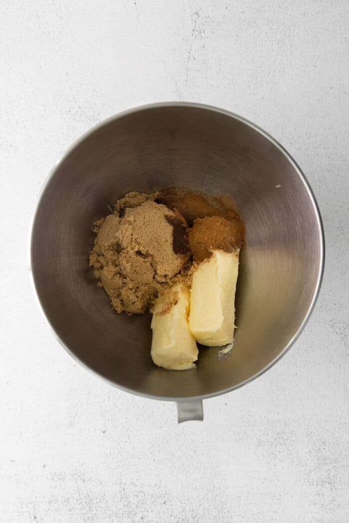 Butter, brown sugar, and spices in a metal bowl
