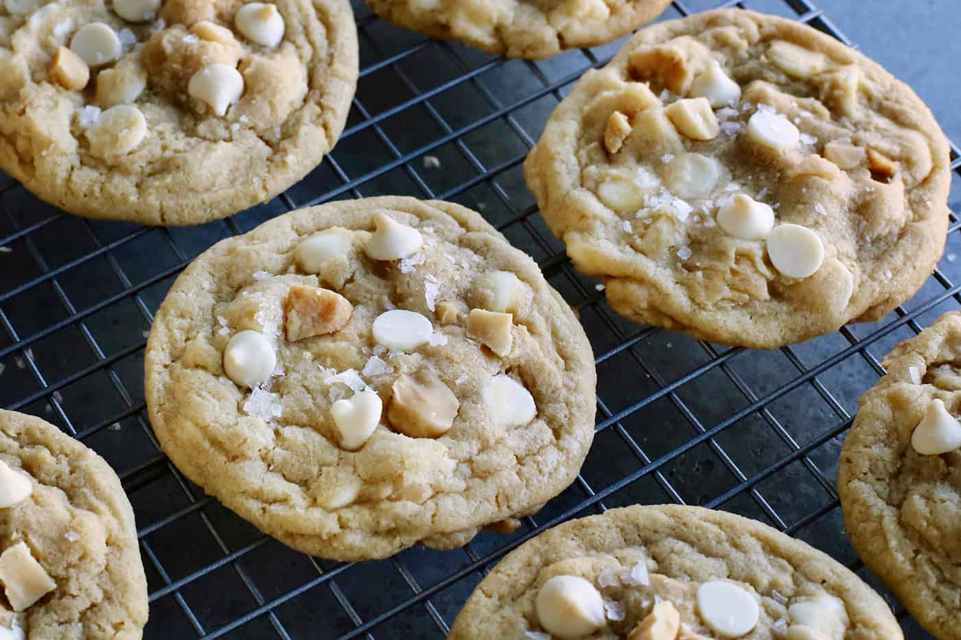 White chocolate macadamia nut cookies on a cooling rack