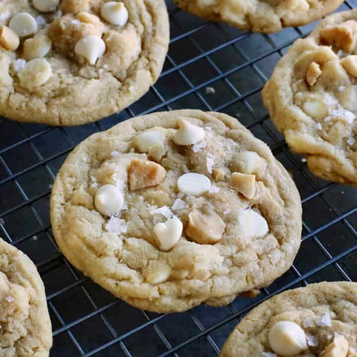 White chocolate macadamia nut cookies on a cooling rack