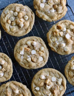 White chocolate macadamia nut cookies on a cooling rack
