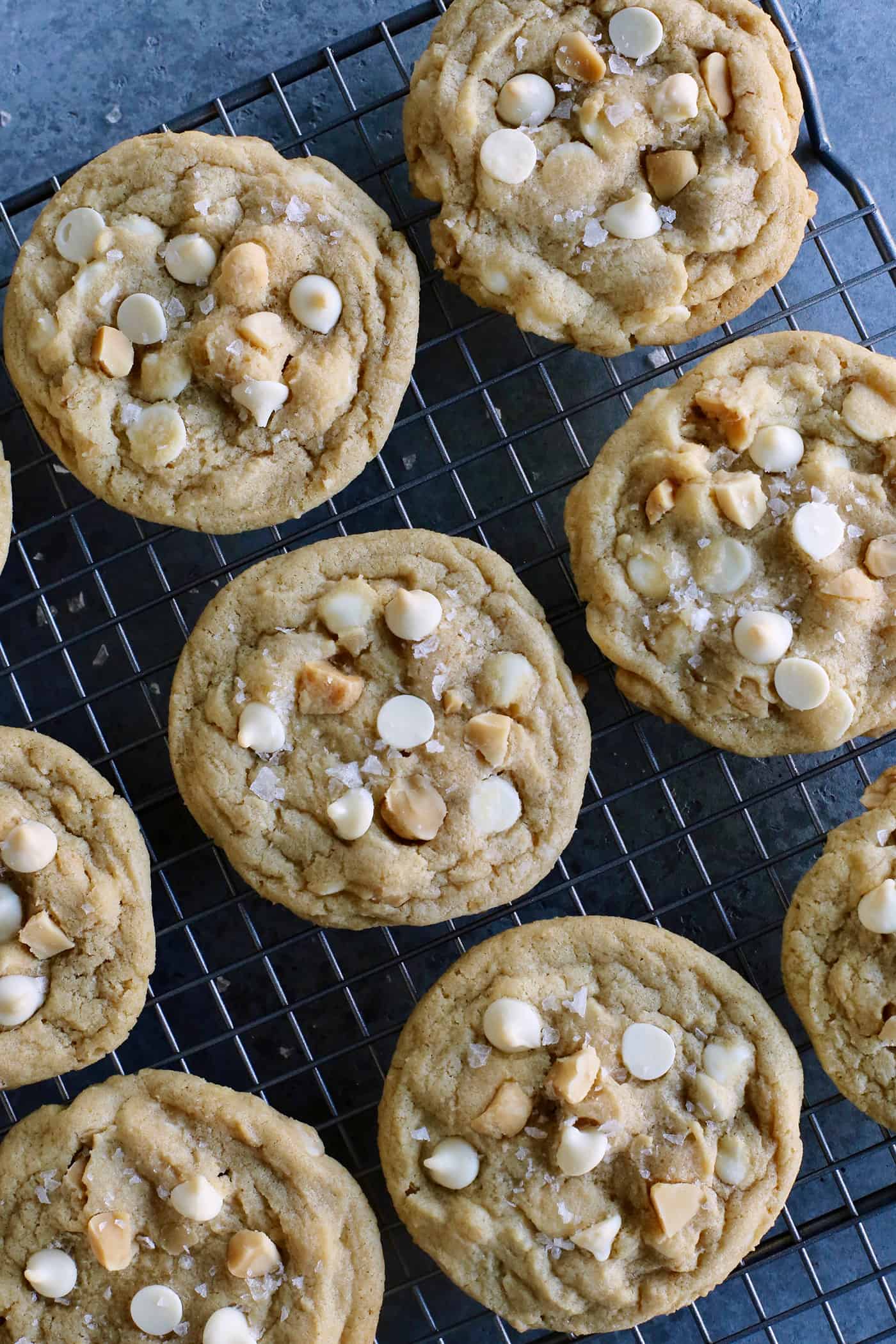 White chocolate macadamia nut cookies on a cooling rack