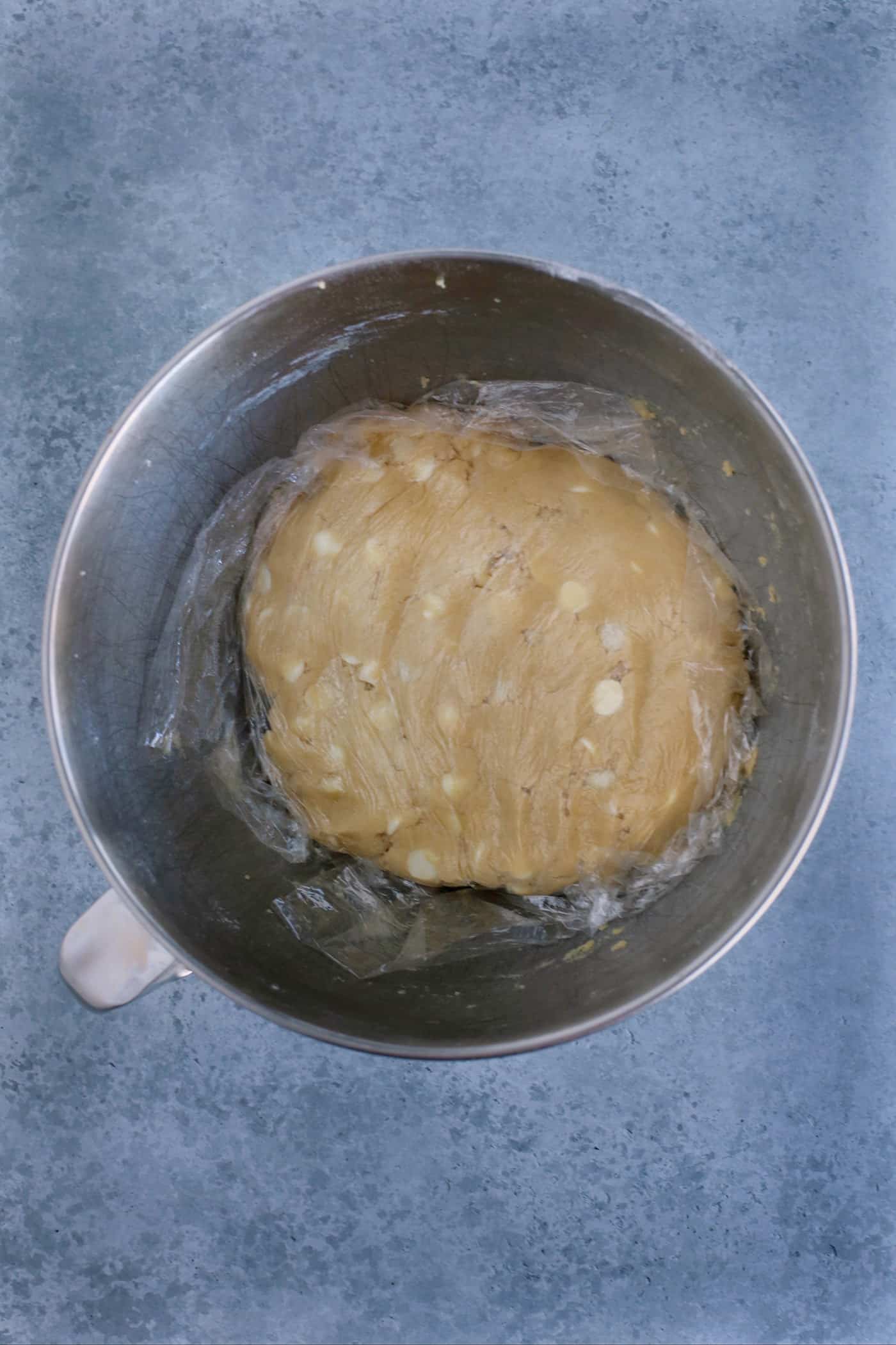 Cookie dough in a bowl covered with plastic