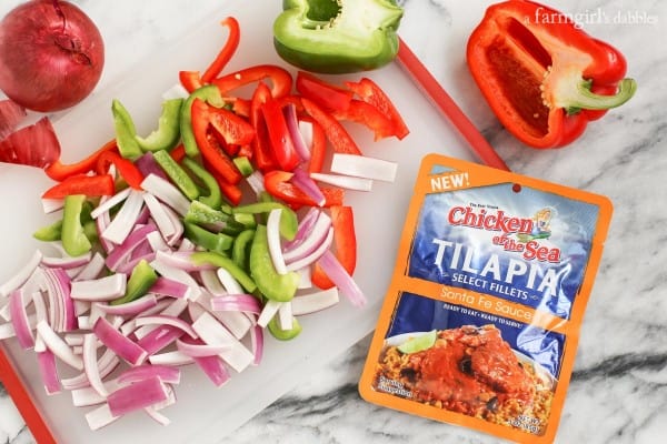 sliced onion and bell peppers with a chicken of the sea tilapia pouch