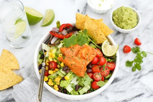 Tilapia Salad Bowl with tortilla chips and guacamole