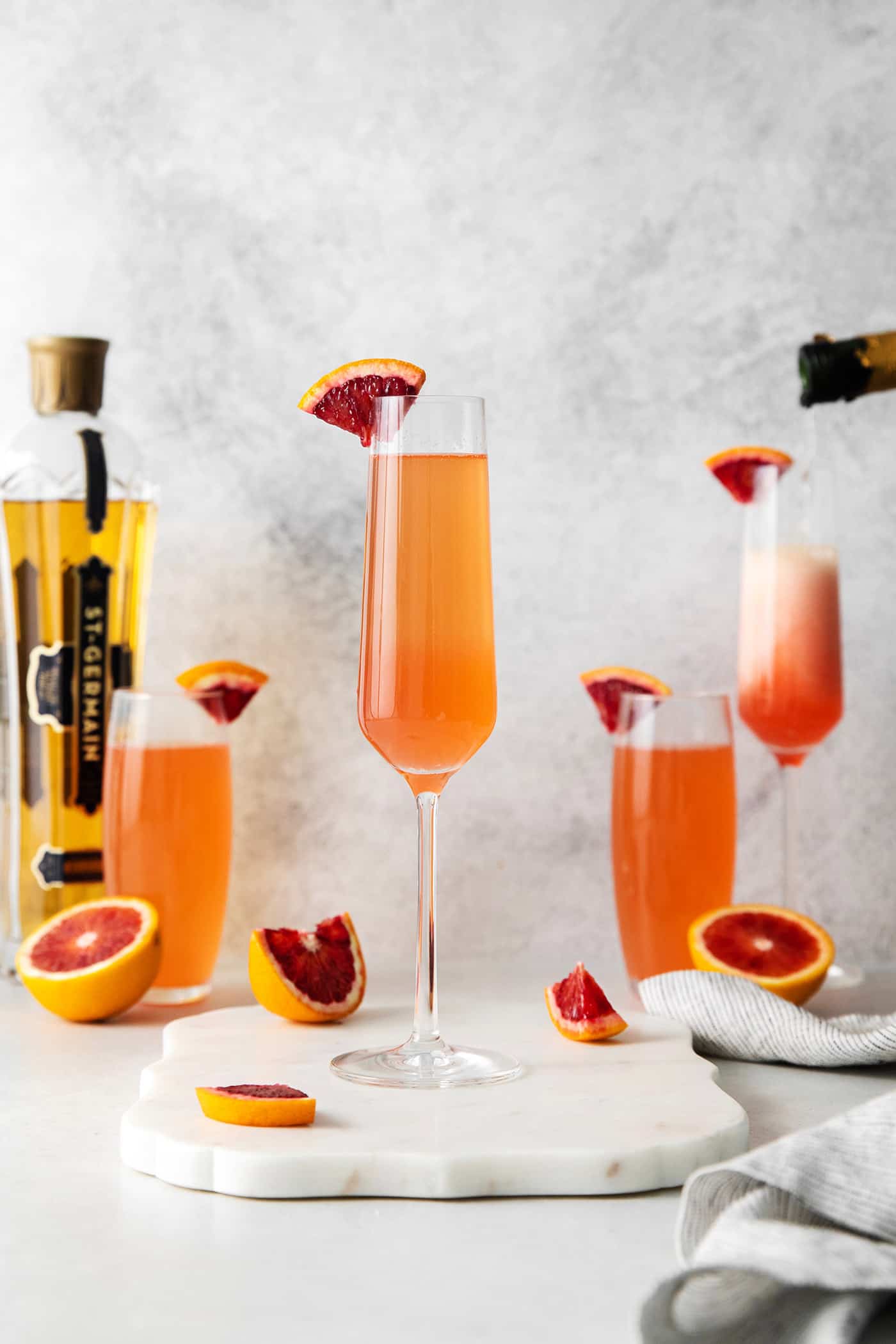 Blood orange mimosas in champagne flutes