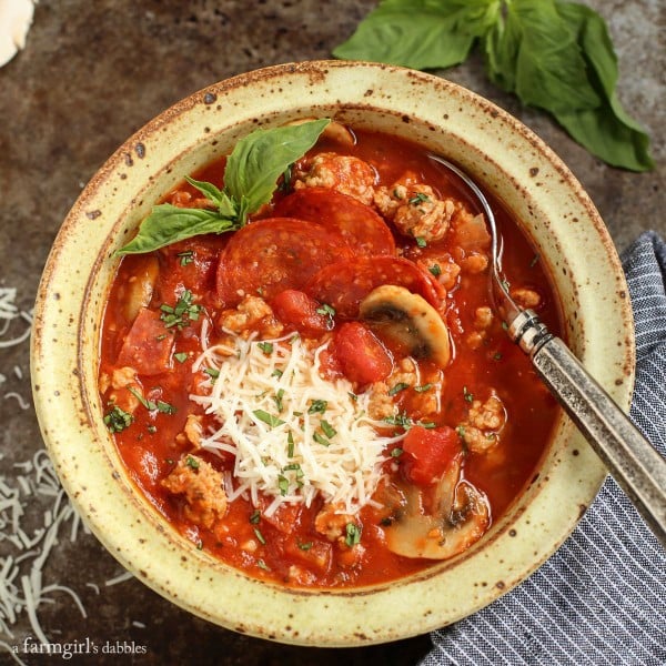 Cheesy Pizza Soup in a pottery bowl