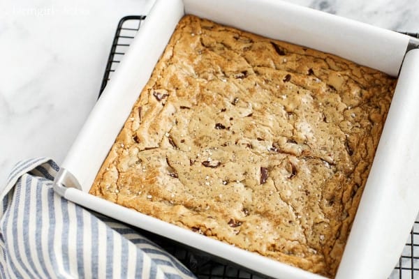 a square baking pan of Chocolate Chunk Blondies with Sea Salt