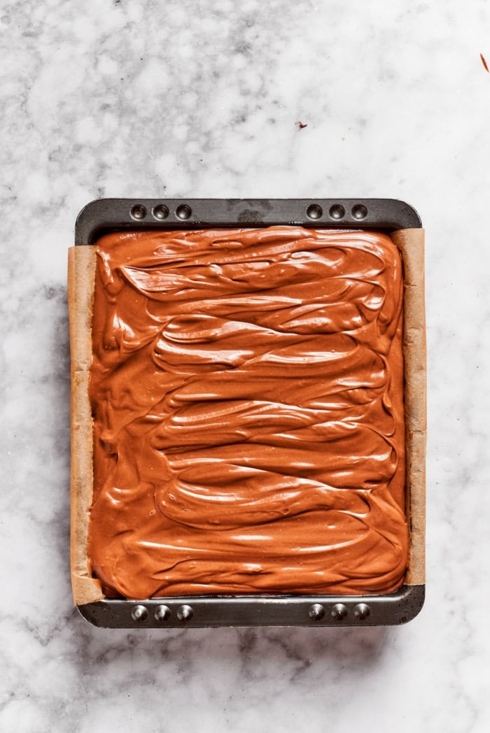 Nutella cheesecake bars in pan before baking.