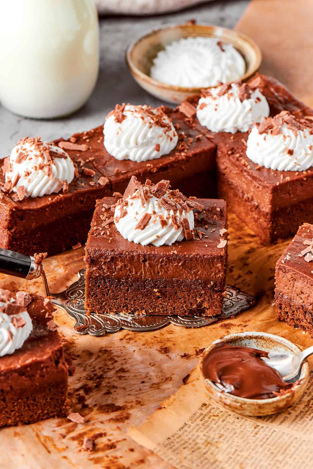 Nutella cheesecake bar held on cake server.