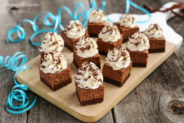 nutella cheesecake with brownie layer on a wood serving board