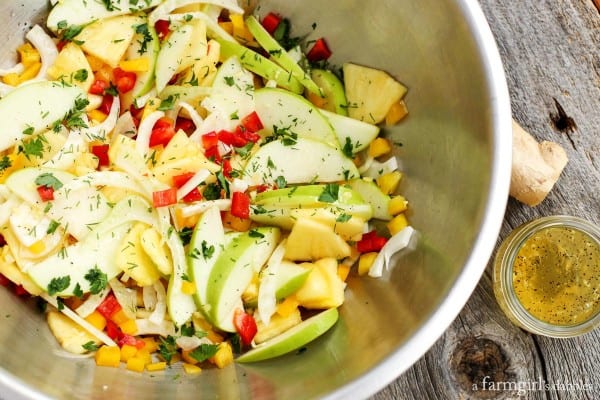 Green Apple, Pineapple, and Fennel Salad with Honey Ginger Dressing in a large metal bowl