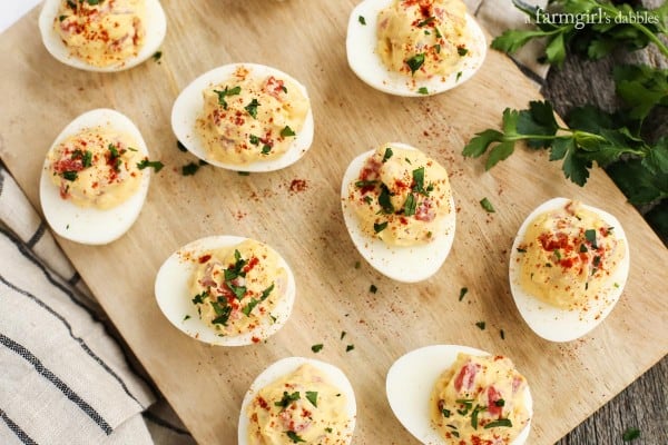 Deviled Eggs with a smoky tomato filling topped with cilantro
