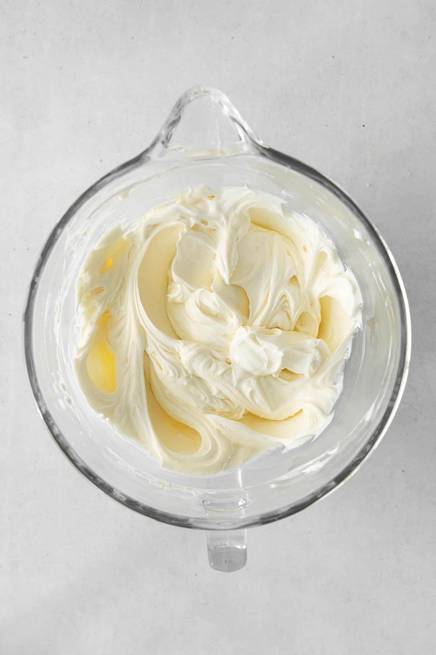 Cream cheese and sugar in a mixing bowl