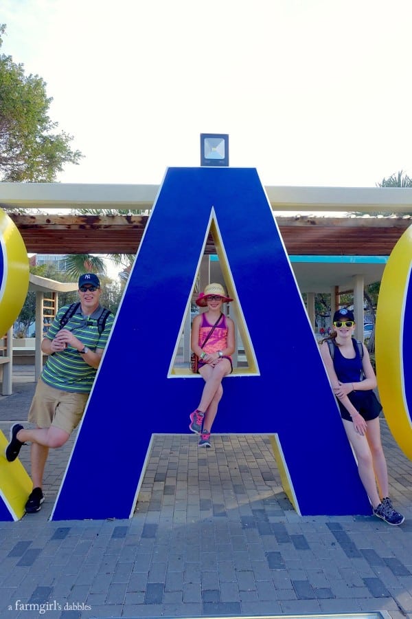 family photo with a sign in Curaçao