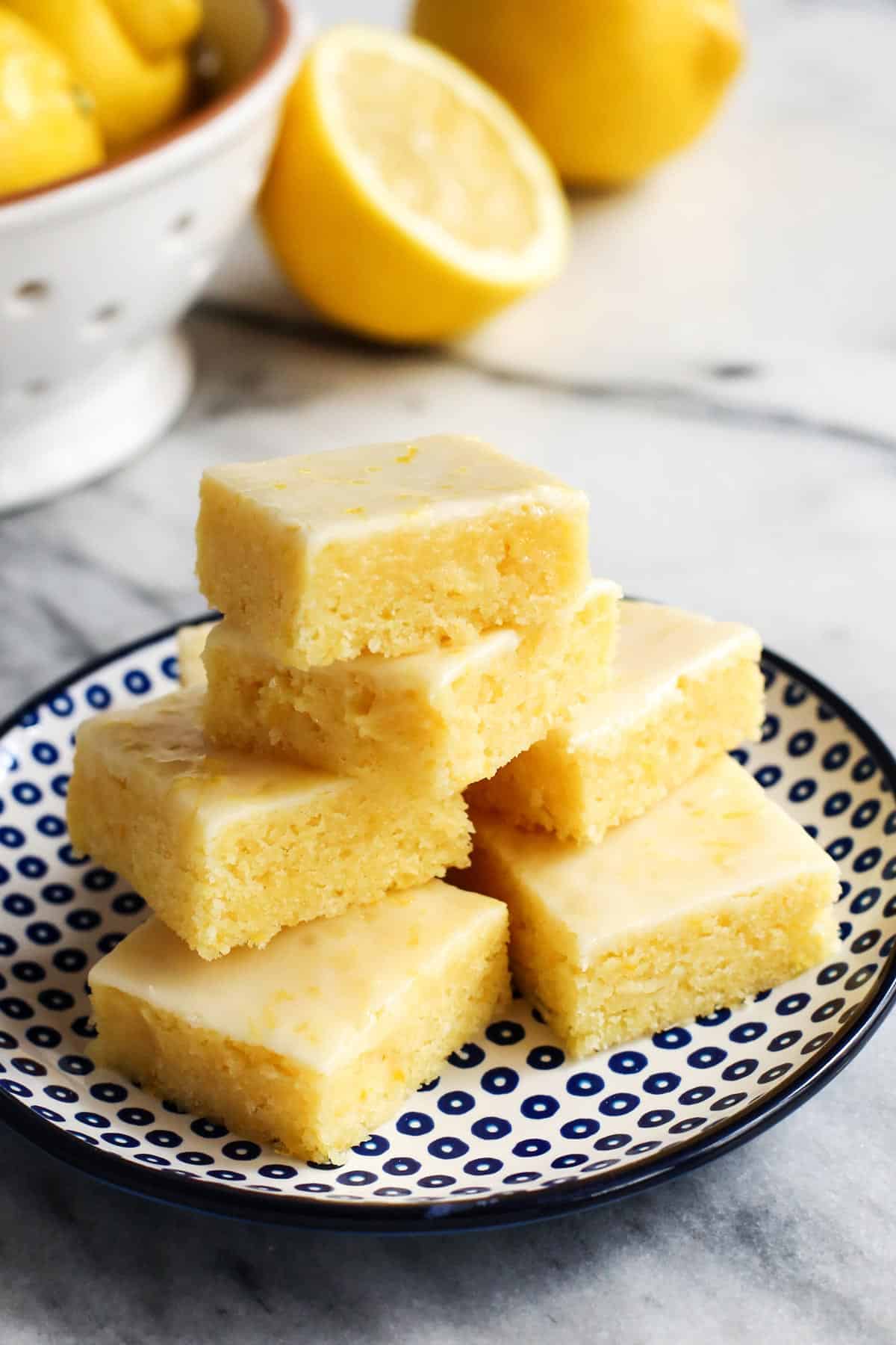 fresh lemon bars stacked on a plate