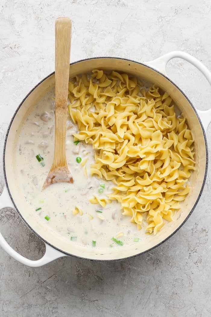 This sour cream and onion tuna noodle casserole is creamy, comforting and delicious. It’s an easy, nostalgic dinner with a bold flavor twist! Egg noodles added to creamy sauce for tuna casserole.