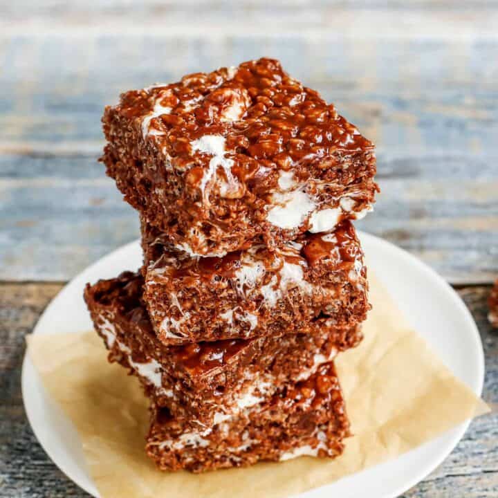 3 chocolate rice krispies treats stacked on a plate