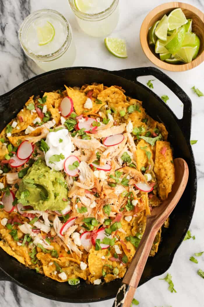 Overhead view of skillet chilaquiles verdes with chicken