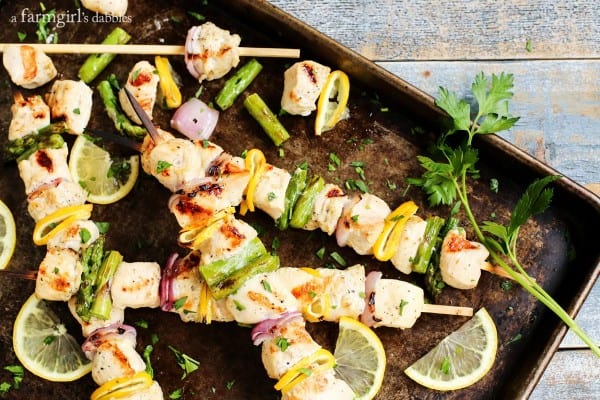 Grilled Lemon Pepper Chicken Kebabs on a baking sheet