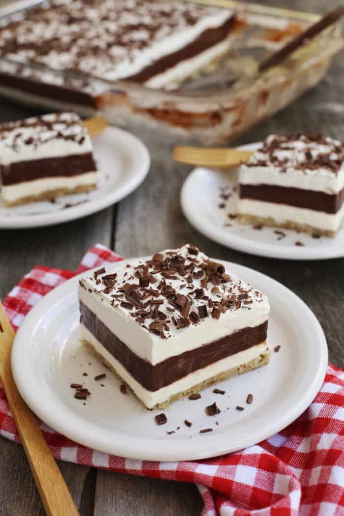 Three slices of layered chocolate pudding on plates