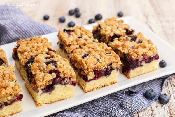 Blueberry Oat Crumble Bars with a blue striped napkin