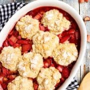 Strawberry Rhubarb Cobbler in a white baking dish