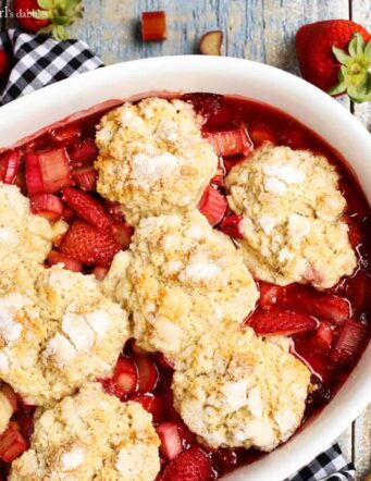 Strawberry Rhubarb Cobbler in a white baking dish