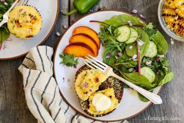 Muffins with salad on a white plate