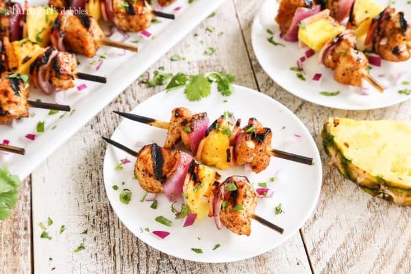 Grilled Hawaiian Chicken Chili Kebabs  on a wooden table