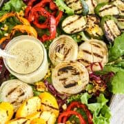 Grilled Veggies Salad with Grilled Vidalia Onion Dressing on a rimmed baking sheet