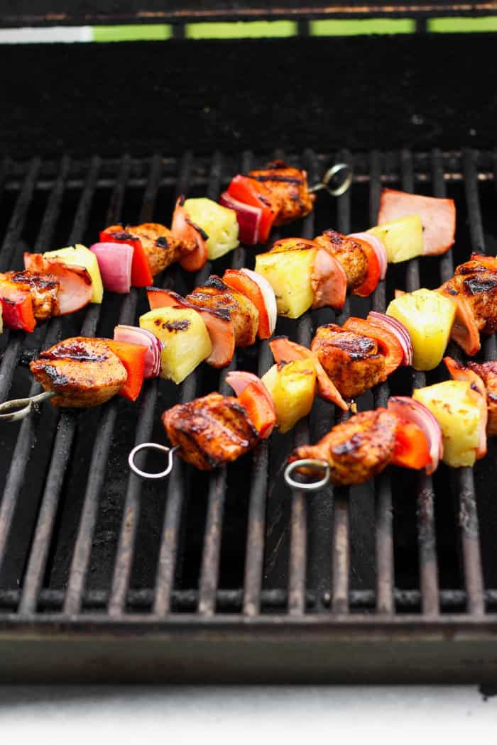 Hawaiian chicken kabobs cooking on grill