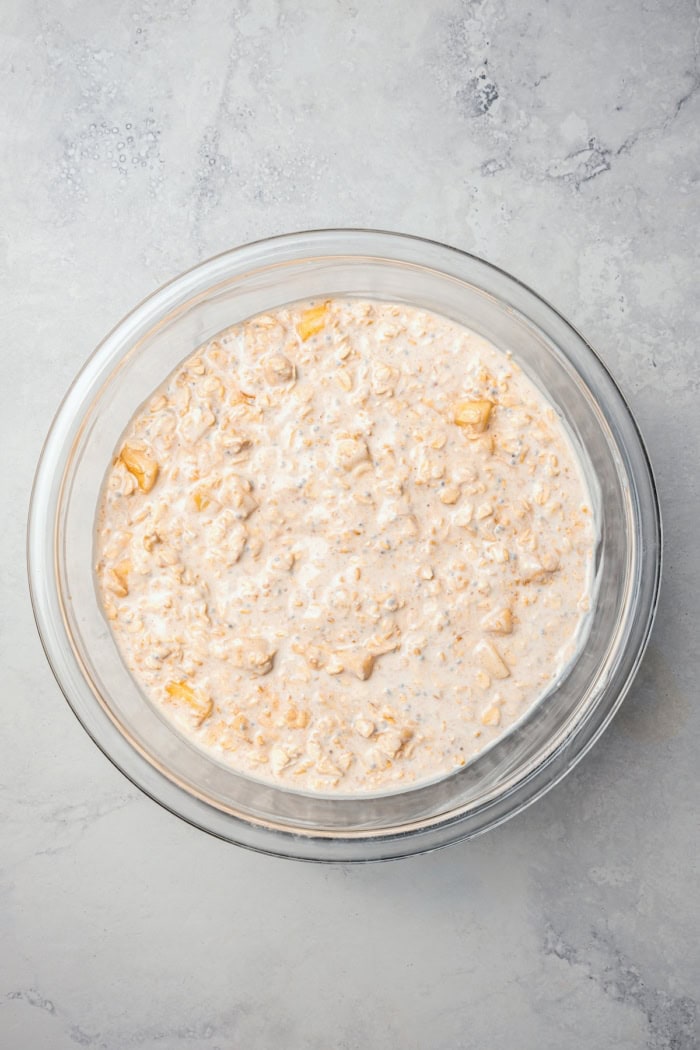 Overhead view of overnight oats in mixing bowl before chilling