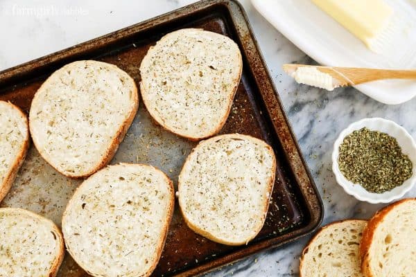 sliced bread with butter and italian herb mix